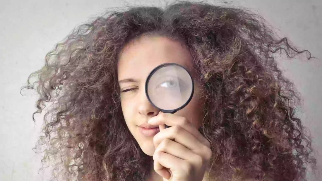 Picture of lady with magnifying glass
