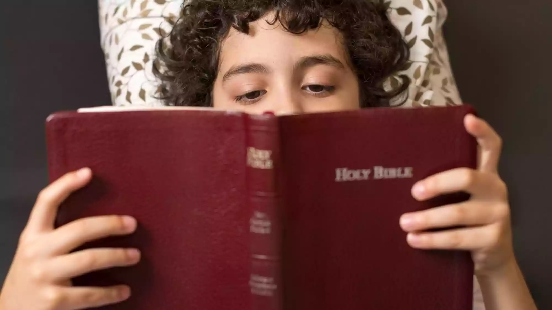 Picture of girl reading the bible